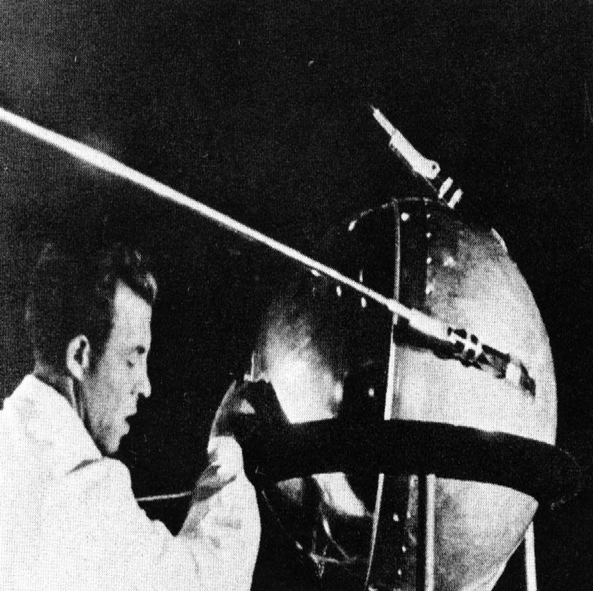 Historic picture of a scientist giving the final touches to the Sputnik, which is Russian for “fellow traveller,” the first artificial satellite in Space.