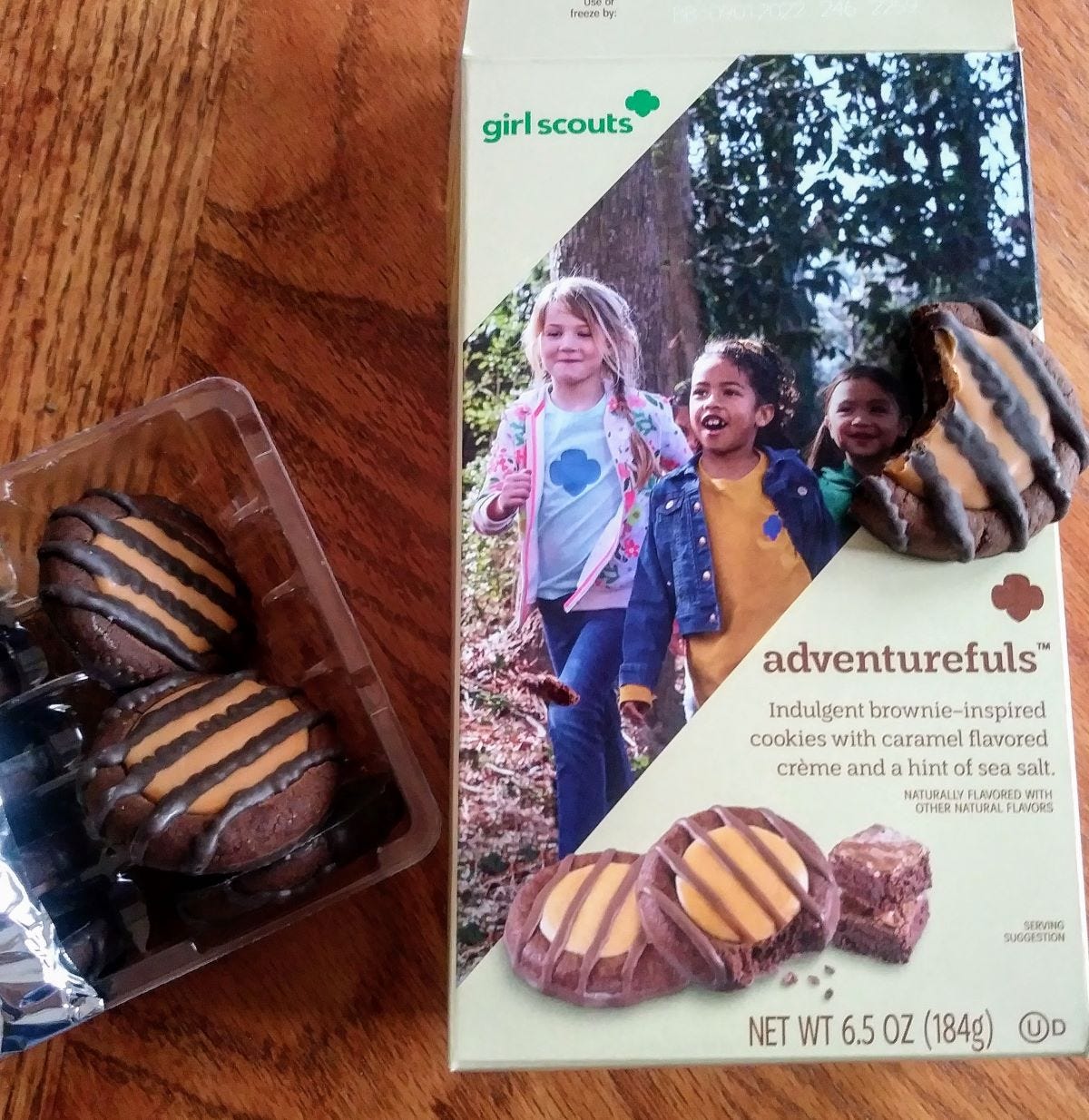 2 Adventurefuls cookies and box.