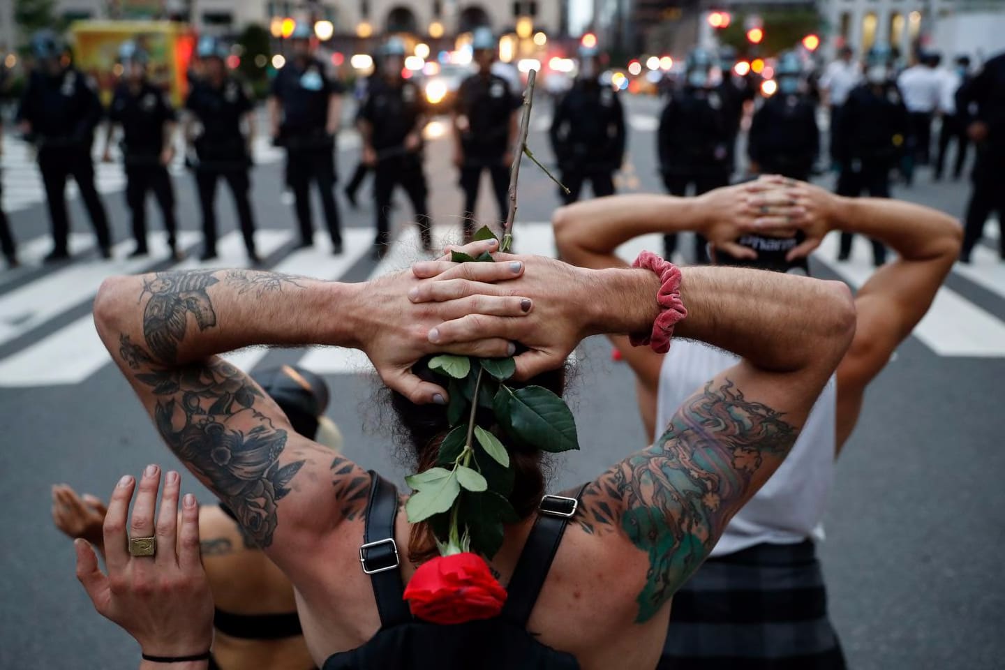 Protesters kneeled in front of New York City Police Department officers before being arrested for violating curfew beside the iconic Plaza Hotel on 59th Street on June 3, 2020 in New York.
