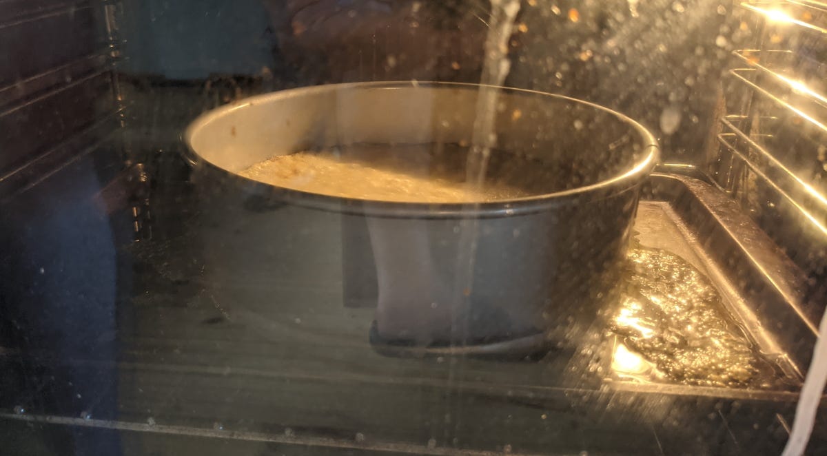 Pie in the oven, leaking rather a lot into the baking tray now.