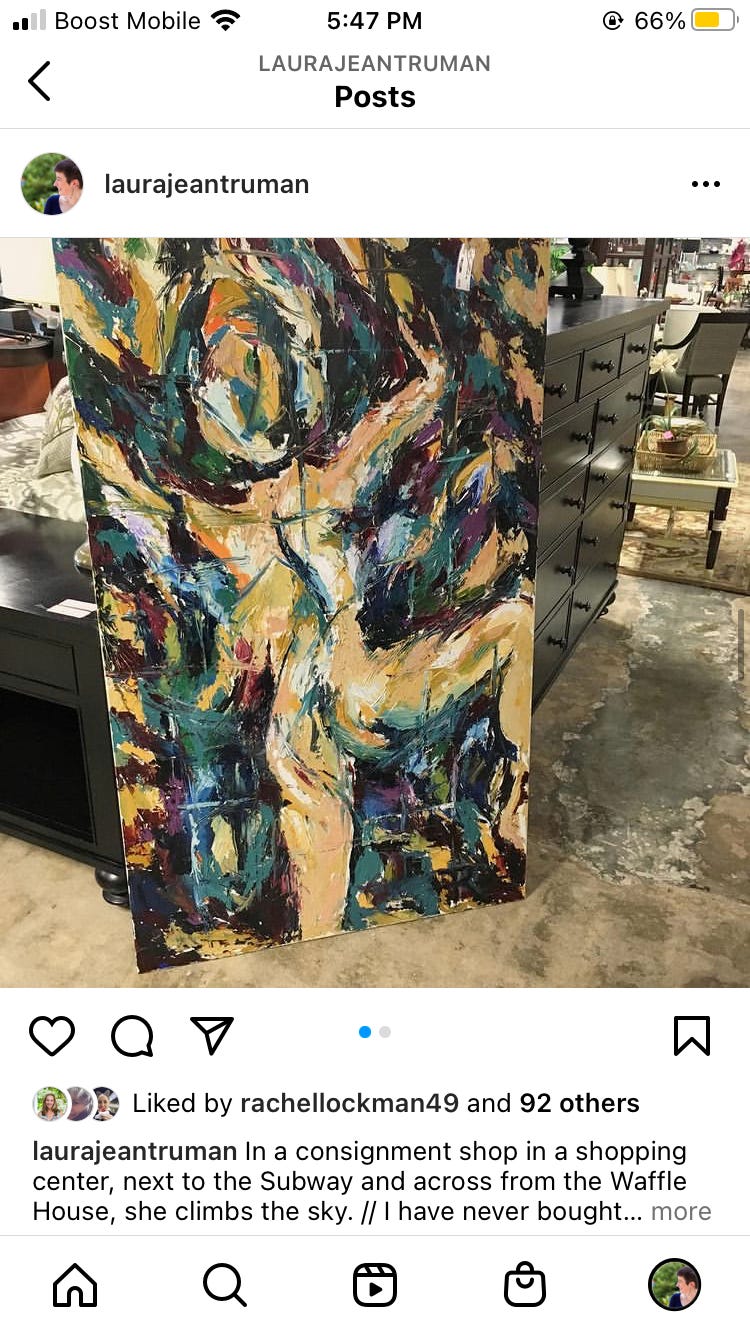 An abstract painting of teals and purples and greens leaning vertically in a consignment shop against a dresser. An image of a woman, naked but very abstract, is climbing - reaching upwards, legs and arms reaching for something above her.
