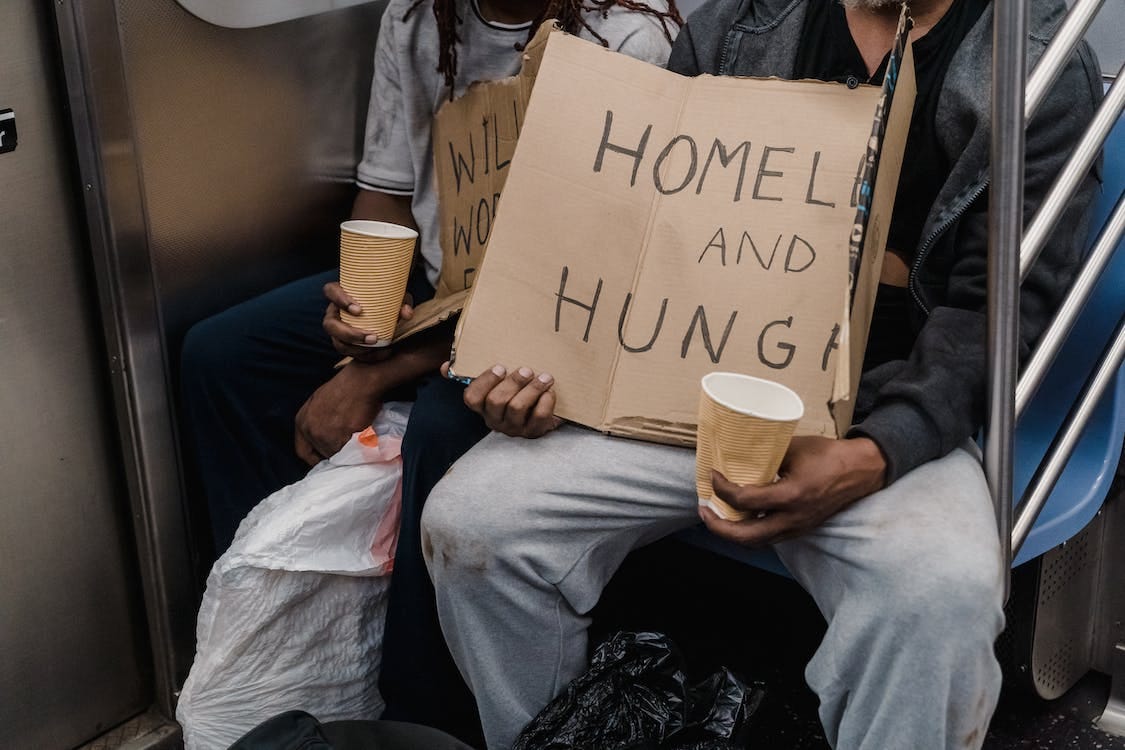Free Homeless People Holding Signs Stock Photo