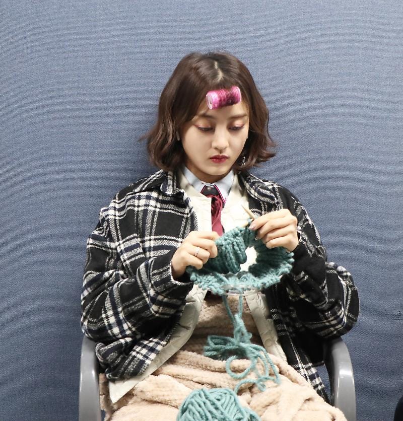 TWICE jihyo knitting a chunky hat with a roller in her bangs