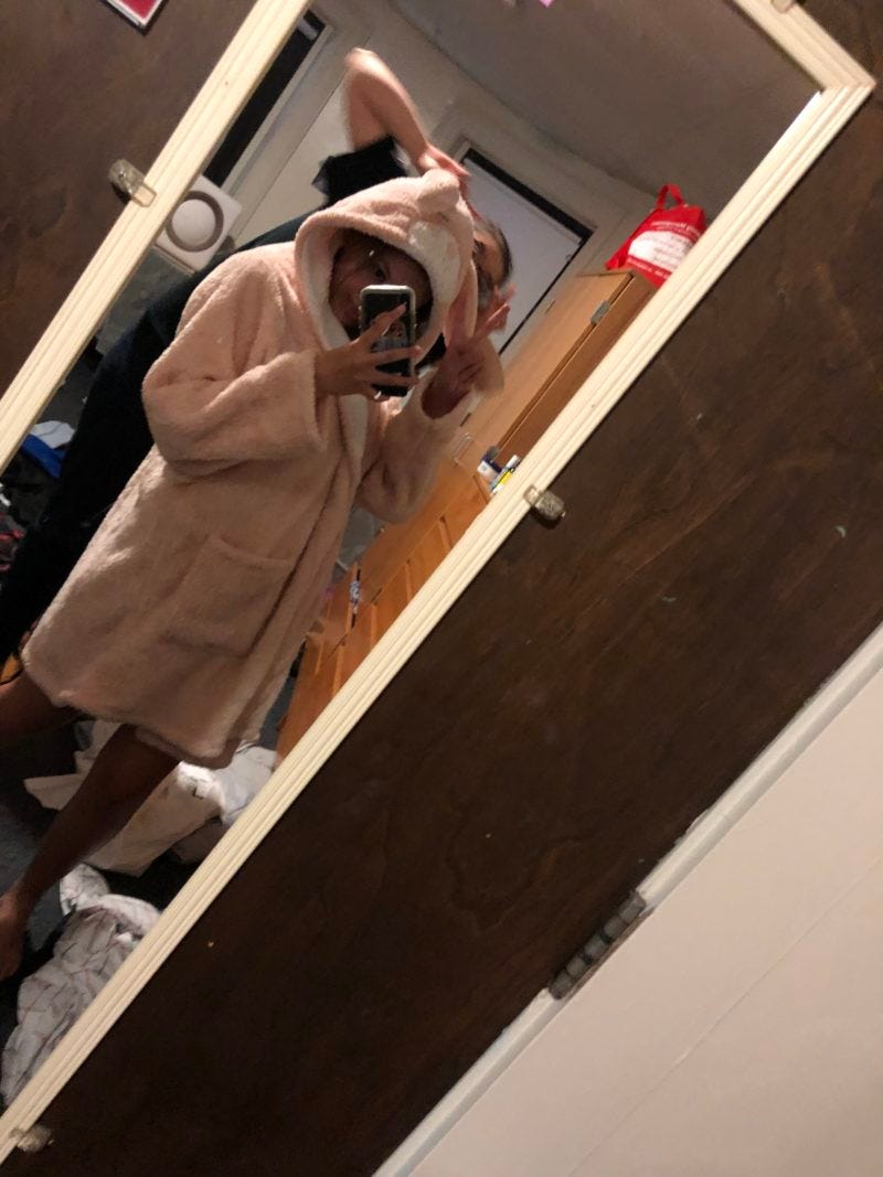 in a fuzzy pink bunny robe