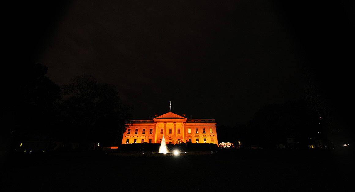 The White House lit up with an eerie orange glow.