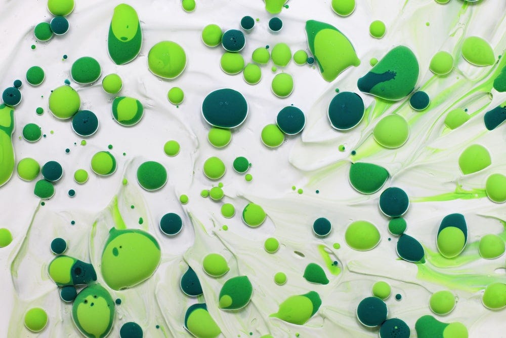 green and white polka dot textile
