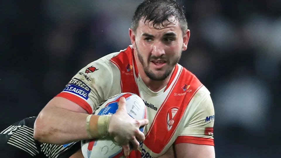 Adam Walker is pictured running the ball in a Super League match for Hull KR.
