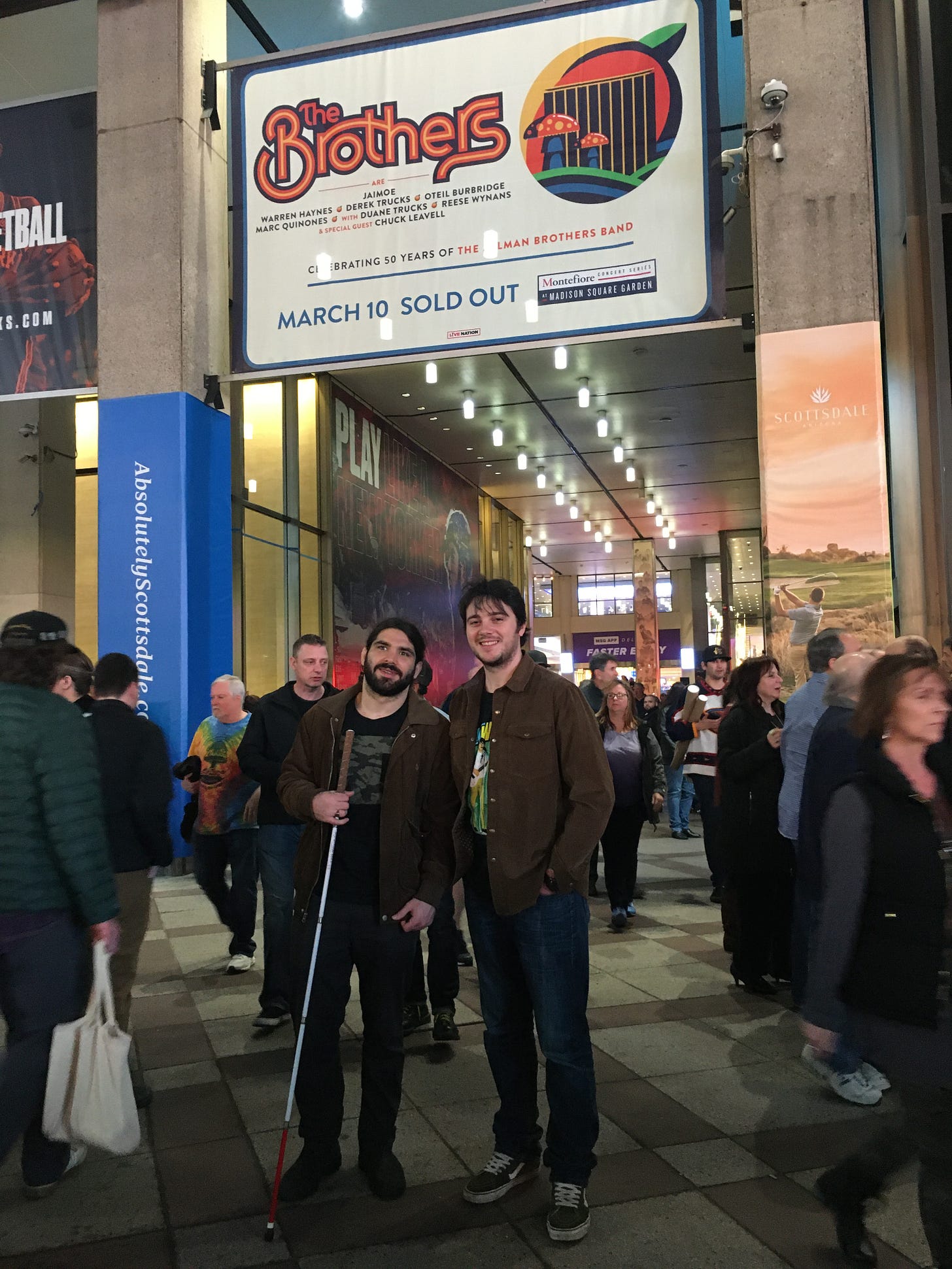 anthony and nick stand in front of MSG with cane and the brothers sign