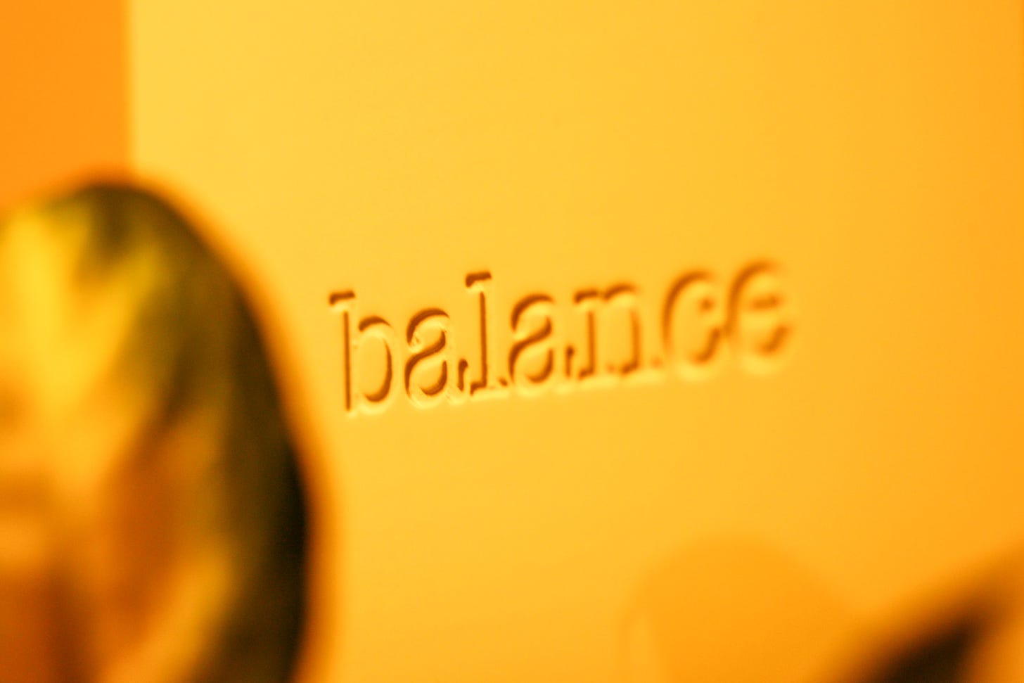 the word balance fading out of focus into soft light