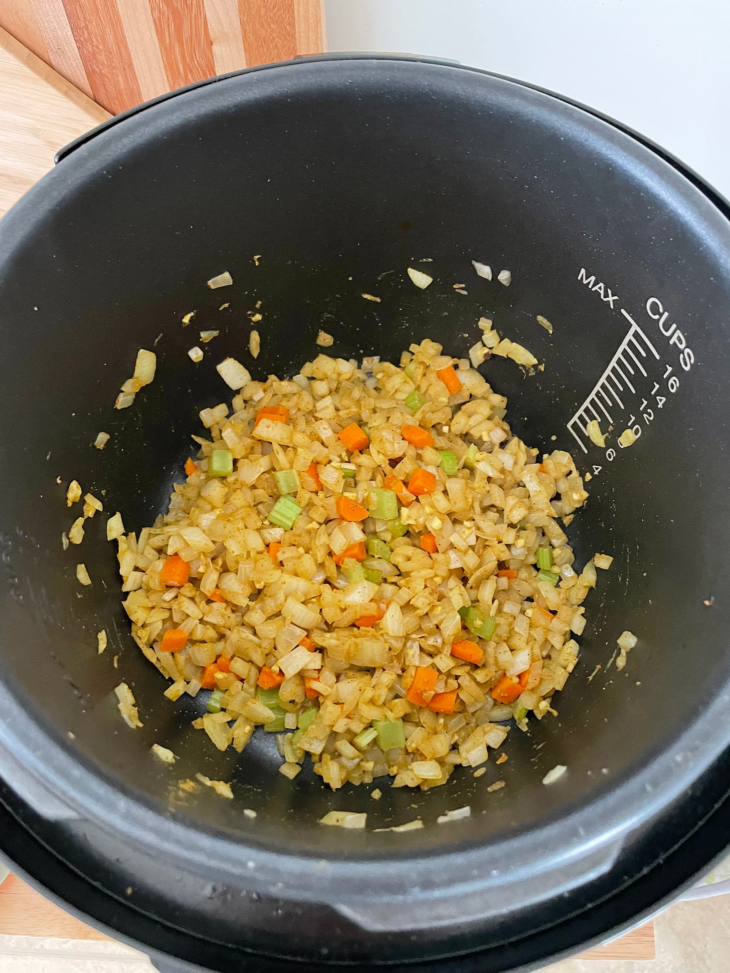 Onion garlic carrot and celery mixed with curry powder