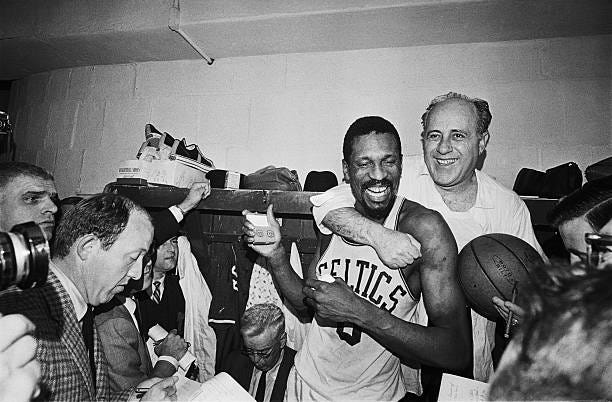Happy twosome shown here, is Red Auerbach who coached his last Celtic's game that won their 8th straight NBA playoff championship by beating the...