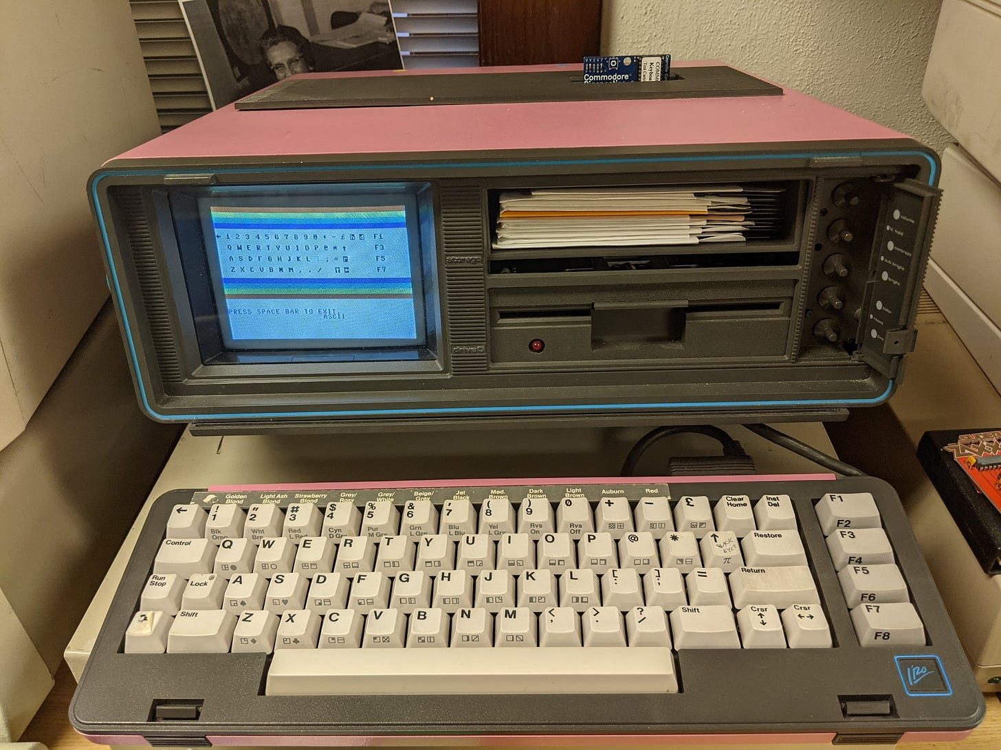 pink commodore sx64 running a keyboard diagnostics program