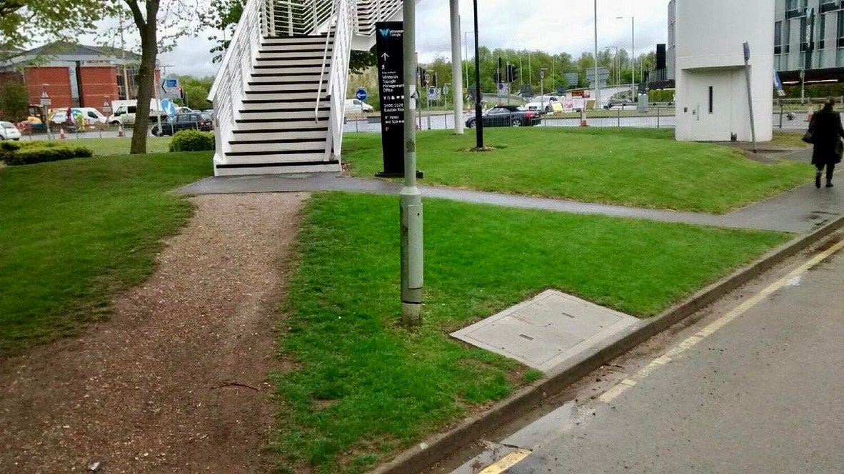 User-Centered Design suggests identifying well-trodden ‘desire paths’ and designing for them (in this case by paving a new sidewalk).