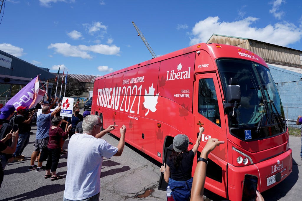 Protesters surround a bus carrying members of the press at a Trudeau campaign stop in Welland, Ontario.