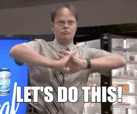 A gif of Dwight Schrute from The Office. He is in the break room standing next to a vending machine flexing his hands forward with a determined face. A caption below reads "LET'S DO THIS!"