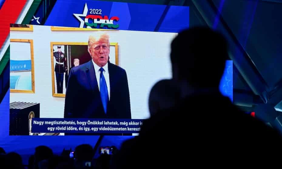 Donald Trump is shown on screen speaking via a videolink at the CPAC conference in Budapest, Hungary, on Friday.