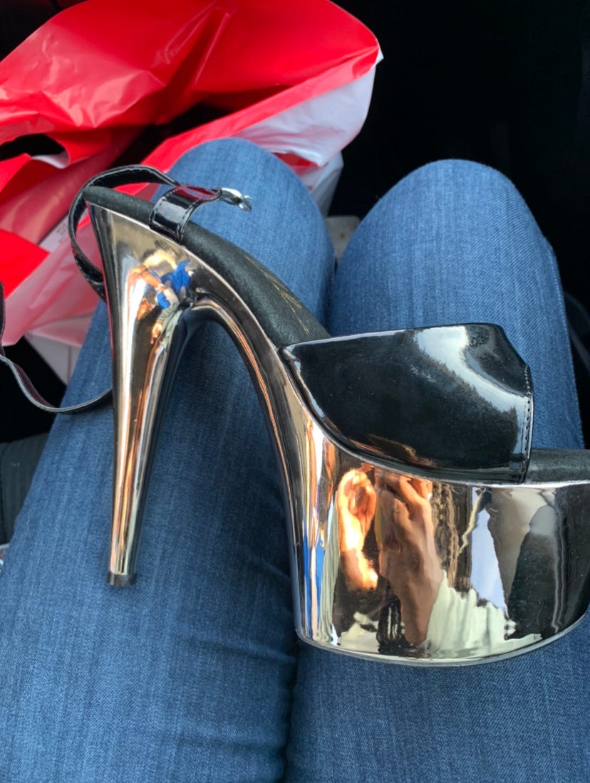 a pic of Ismatu's first pair of stripper heels: black leather Ellie shoes with chrome gold platforms. ugh. what a shoe.