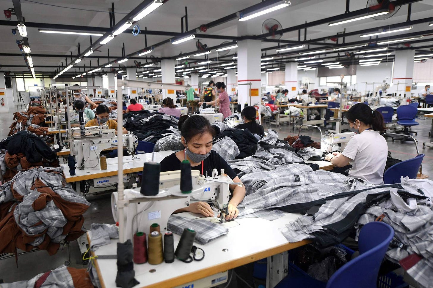 A factory belonging to Maxport Vietnam, which makes activewear for various textile clothing brands, in Hanoi | AFP-JIJI
