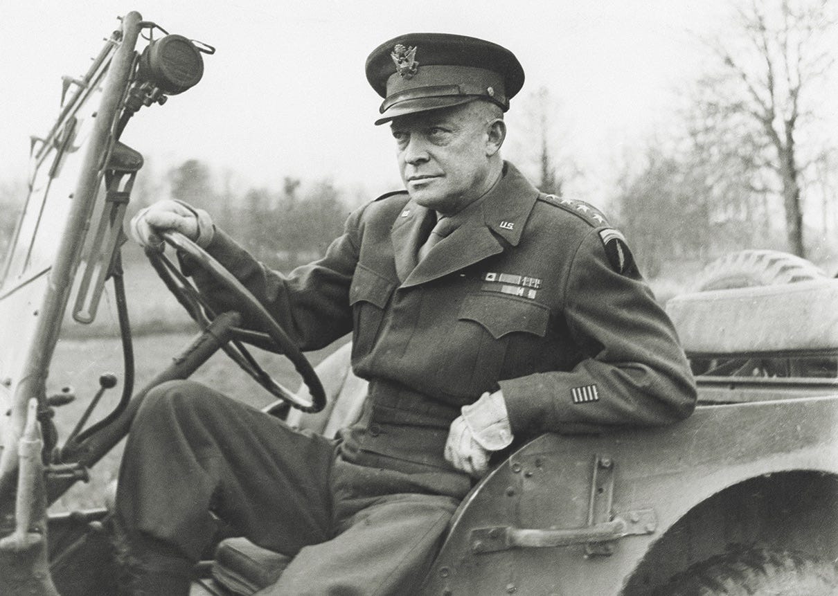 General Dwight D. Eisenhower drives out in his jeep to deliver his  Christmas message to the Allies on Dec. 20, 1944. (Mirrorpix/Alamy Stock  Photo)