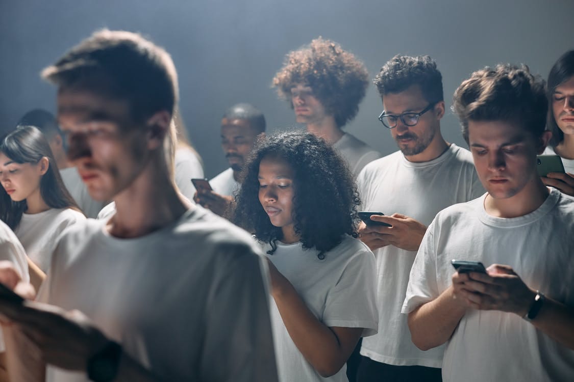 Photo of People Using Smartphones