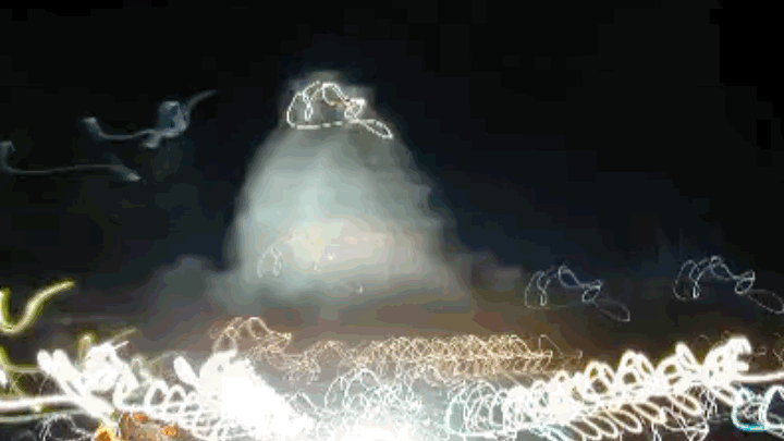 Animated gif of the US capitol building seen with streaks of light from long exposure photography