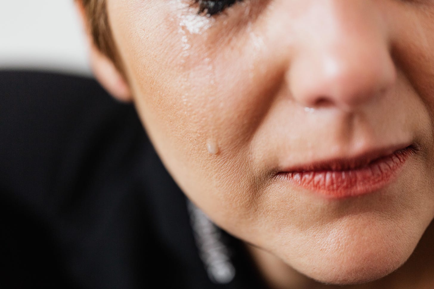 A close-up of a woman crying.