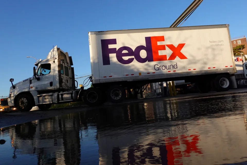 A FedEx delivery truck exits a facility in Brooklyn, New York City, U.S., May 9, 2022. REUTERS/Andrew Kelly