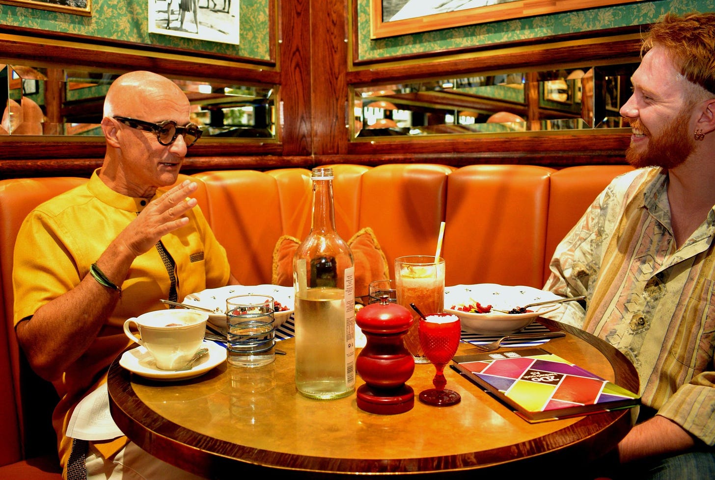 A photo of Babylon CEO Ali Parsa speaking to Sifted reporter Kai Nicol-Schwarz over brunch at Harry's Dolce Vita in Knightsbridge