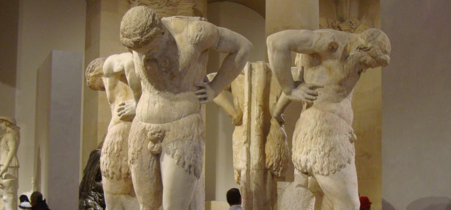Ancient Roman statues of satyres navel gazing.