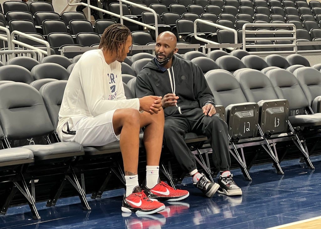 Myles Turner talks with Pacers lead assistant Lloyd Pierce before a game. The two have worked closely together for two years.