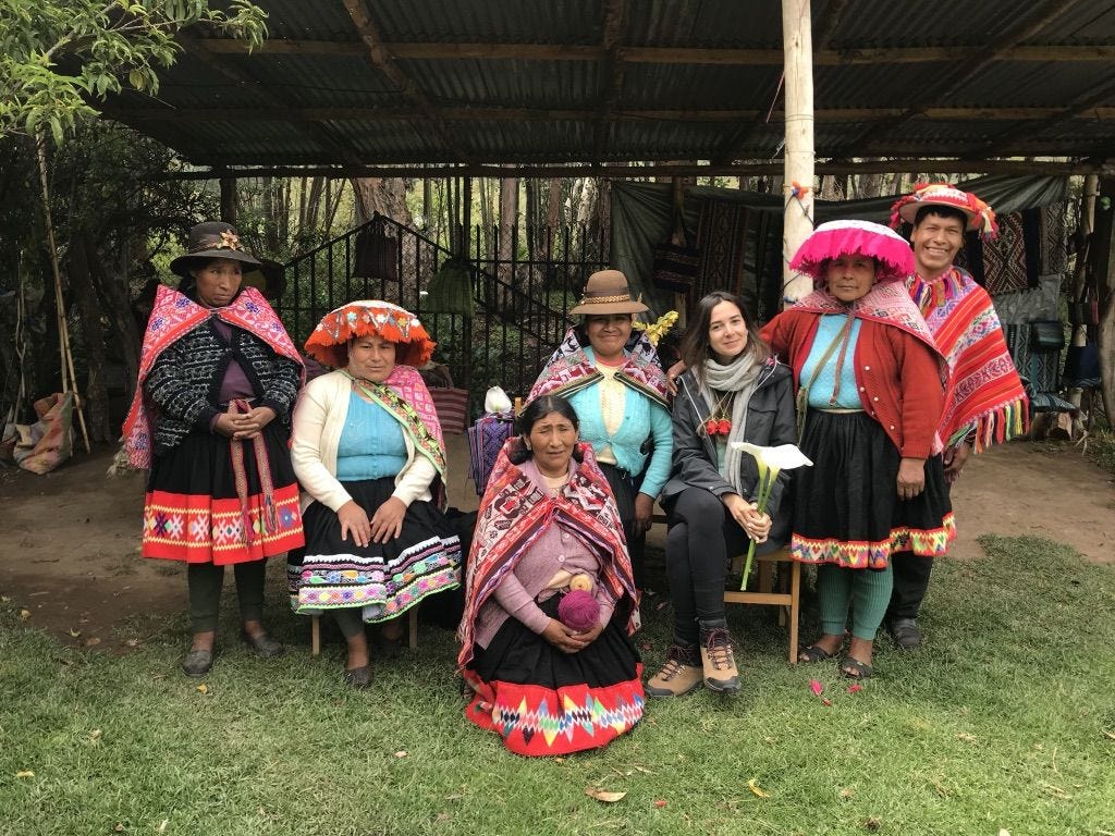 Nahir with 7 indigenous men and women from the Andes posing for a photo