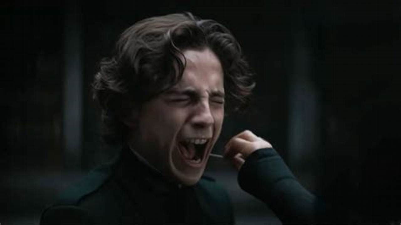 Timothée Chalame screams with a needle against his neck.