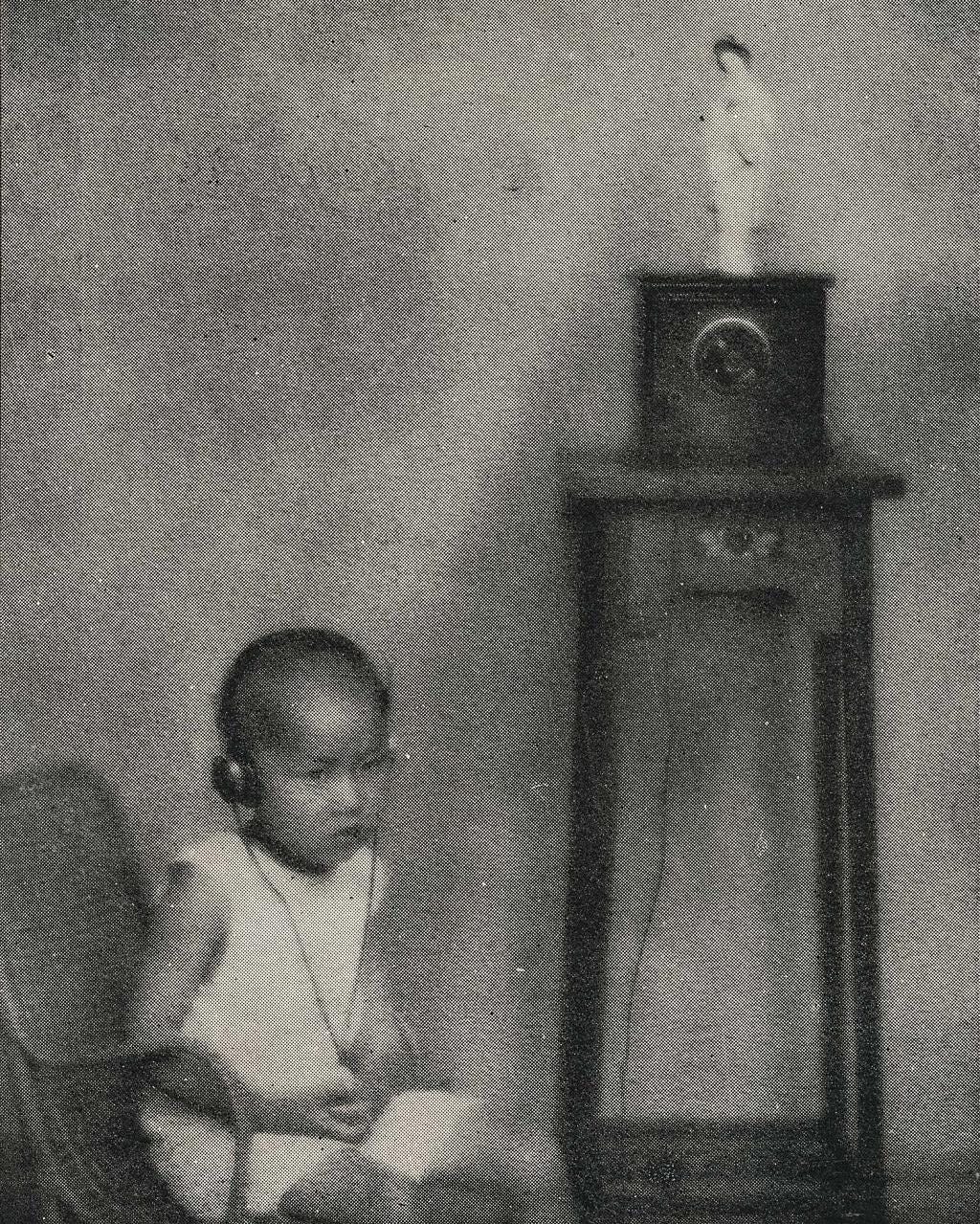 A young boy listens to the radio with headphones