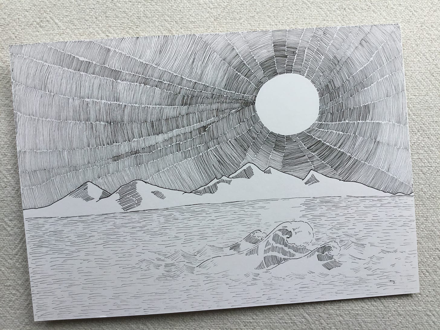 image: photo of my completed line drawing artwork of In Its Place. A landscape drawing of a majestic scene of the sun with intricate lines as sun ray, front by the mountain, and ocean with a rolling wave.