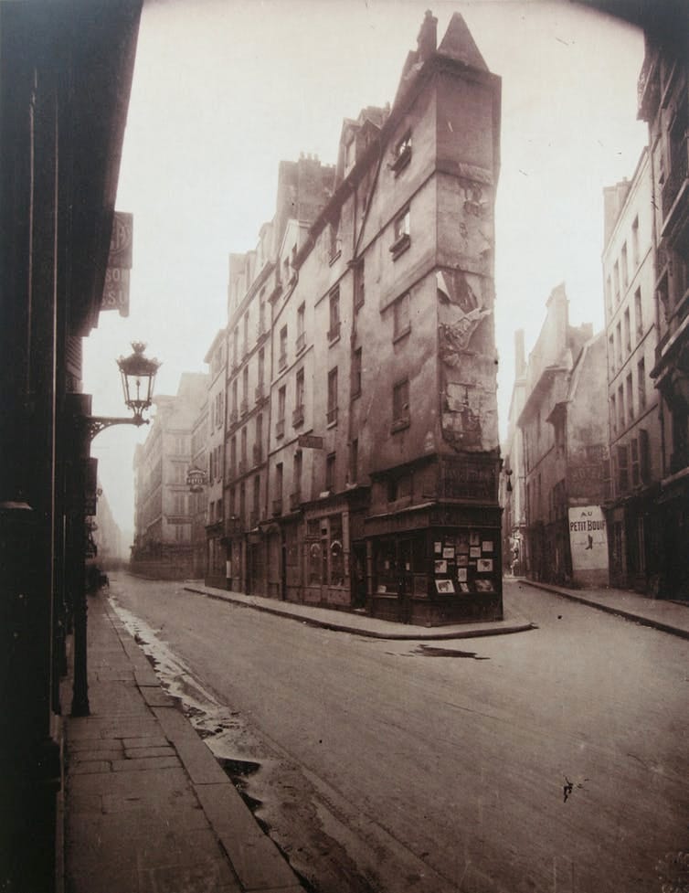 Brown-scale photo of an empty French street.
