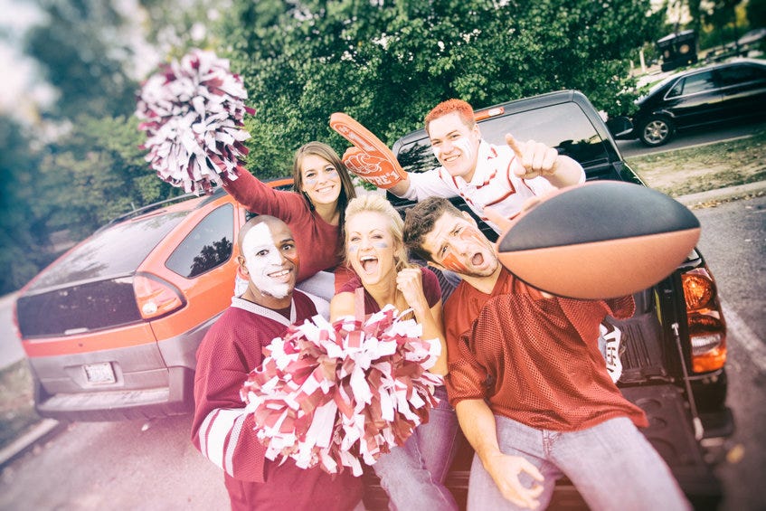Group of college students tailgating