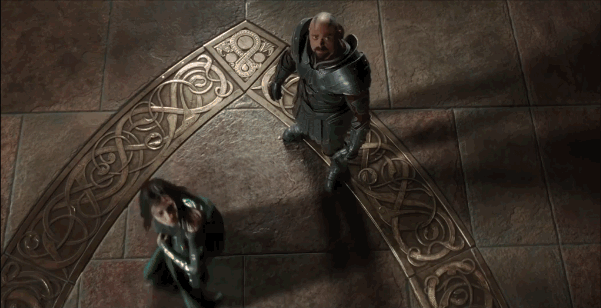 Hela and Skurge in the throne room. she throws her staff at the ceiling to destroy the painted ceiling.