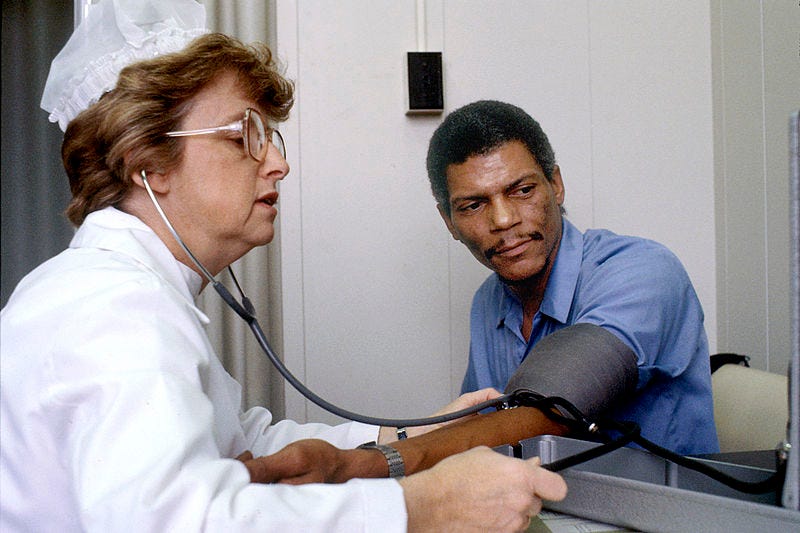 File:Nurse checks blood pressure.jpg