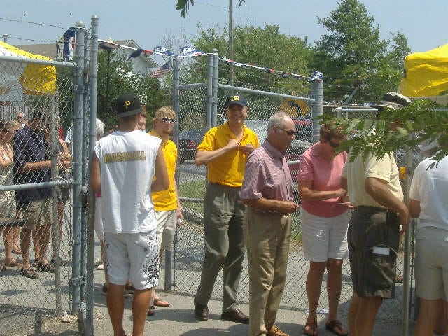 GOP candidate Dr. Andrew Harris (center, in baseball cap) is a little late but none the worse for wear.