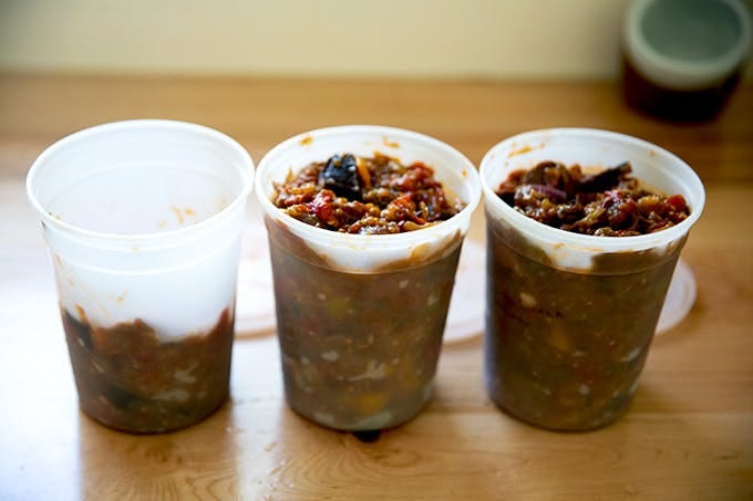 Quart containers filled with roasted ratatouille. 