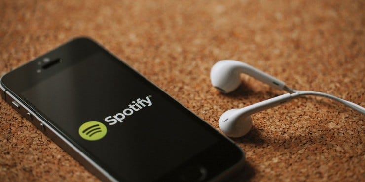 S3 news tmp 178181 spotify logo on phone and earbuds  default  1280