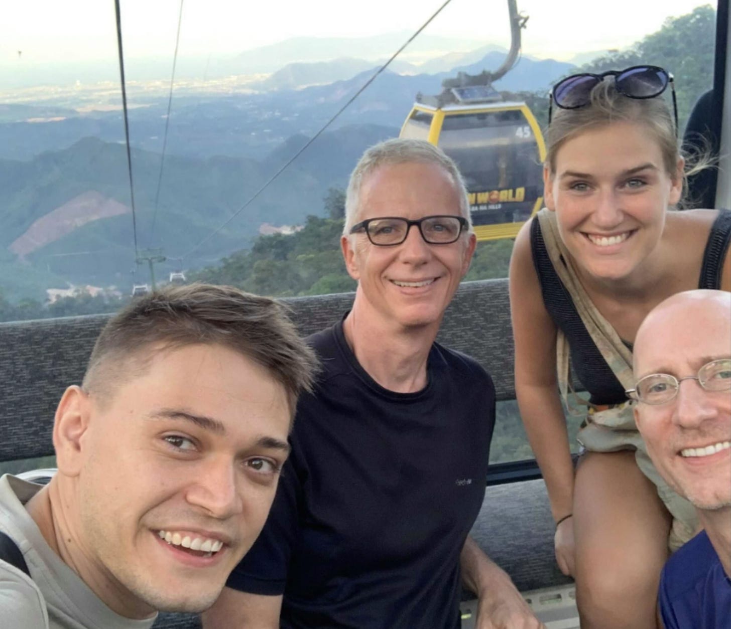 Michael, Brent, Miek, and Mike, in a cable car in the Ba Na Hills in Vietnam.