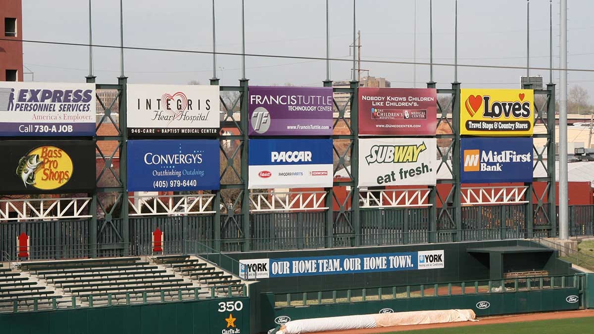 An image of the outfield advertisements in a baseball stadium.