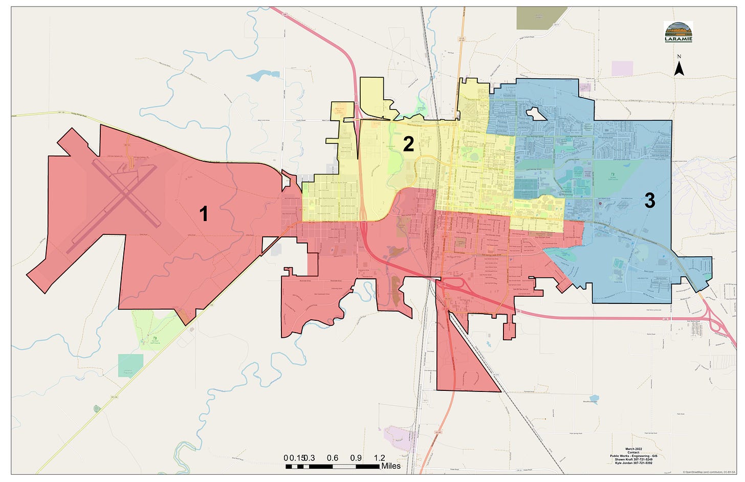 A map of Laramie shades Ward 1 as red, Ward 2 as yellow and Ward 3 as blue. Ward 1 includes the airport and the southwest and south-central portions of Laramie proper. Ward 2 encompasses the northwest and north-central areas of the city, as well as the entire university. Ward 3 encompasses the east of the city.