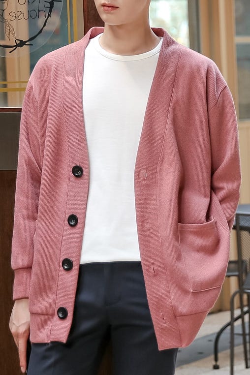 Image of a model wearing a pink wool cardigan