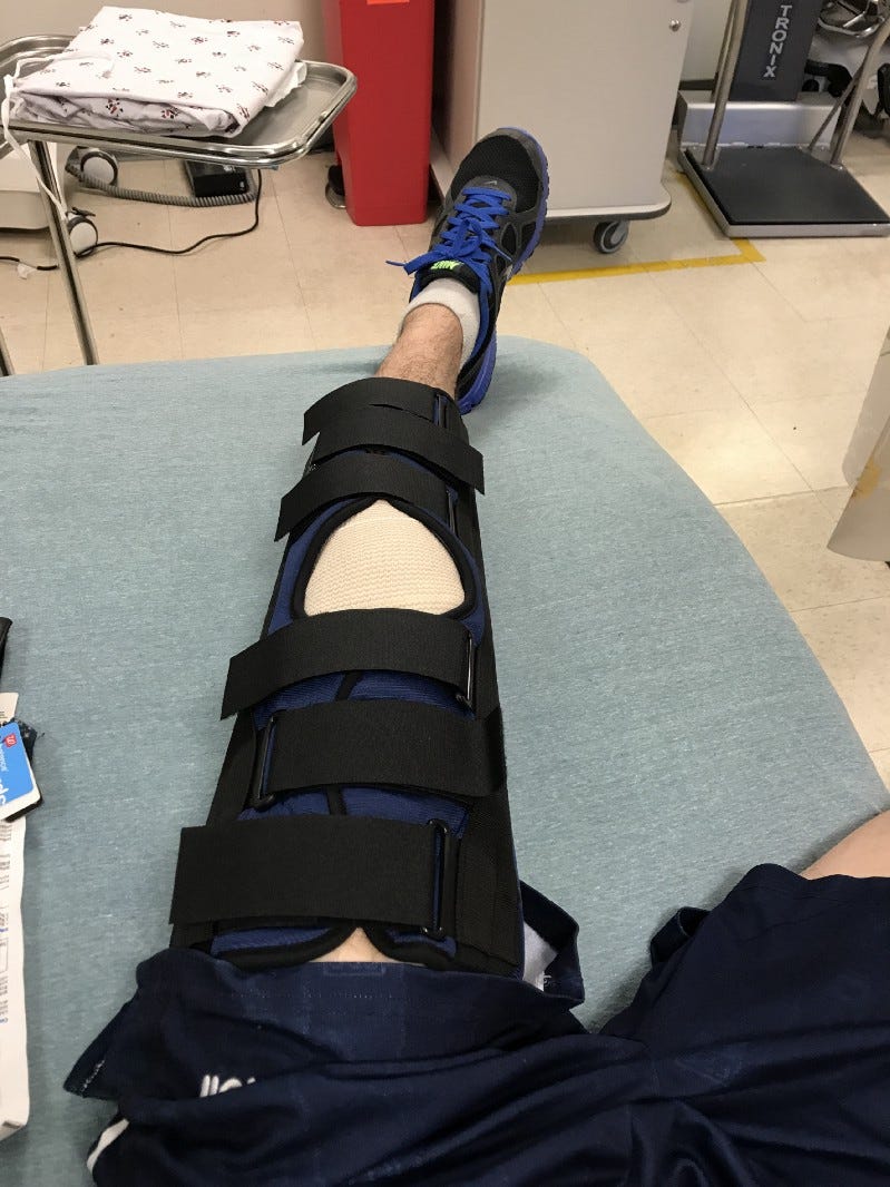 Picture of my perfectly healthy knee with a strange device around it.