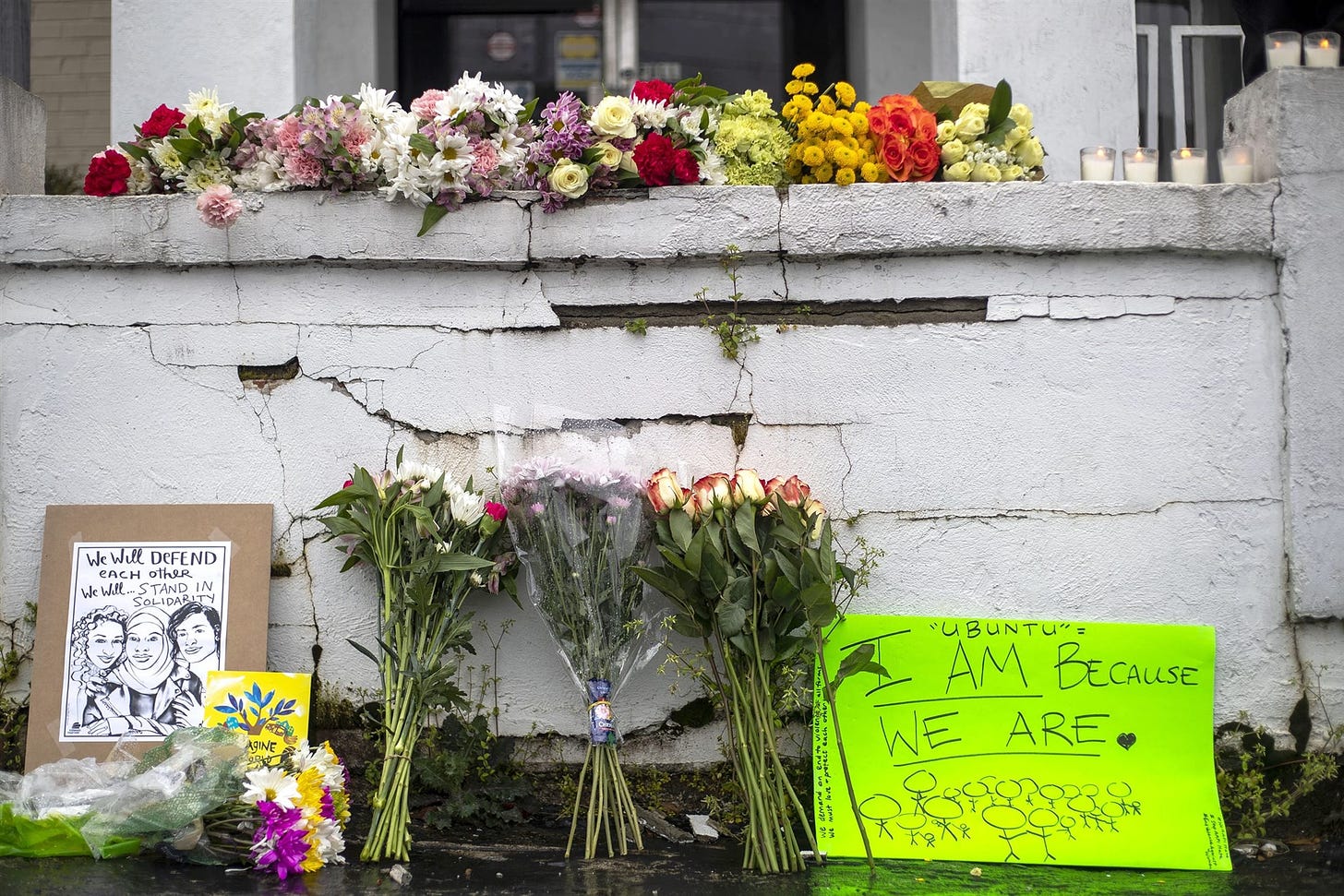 Flowers and signs at a makeshift memorial outside the Gold Spa in Atlanta on Wednesday.