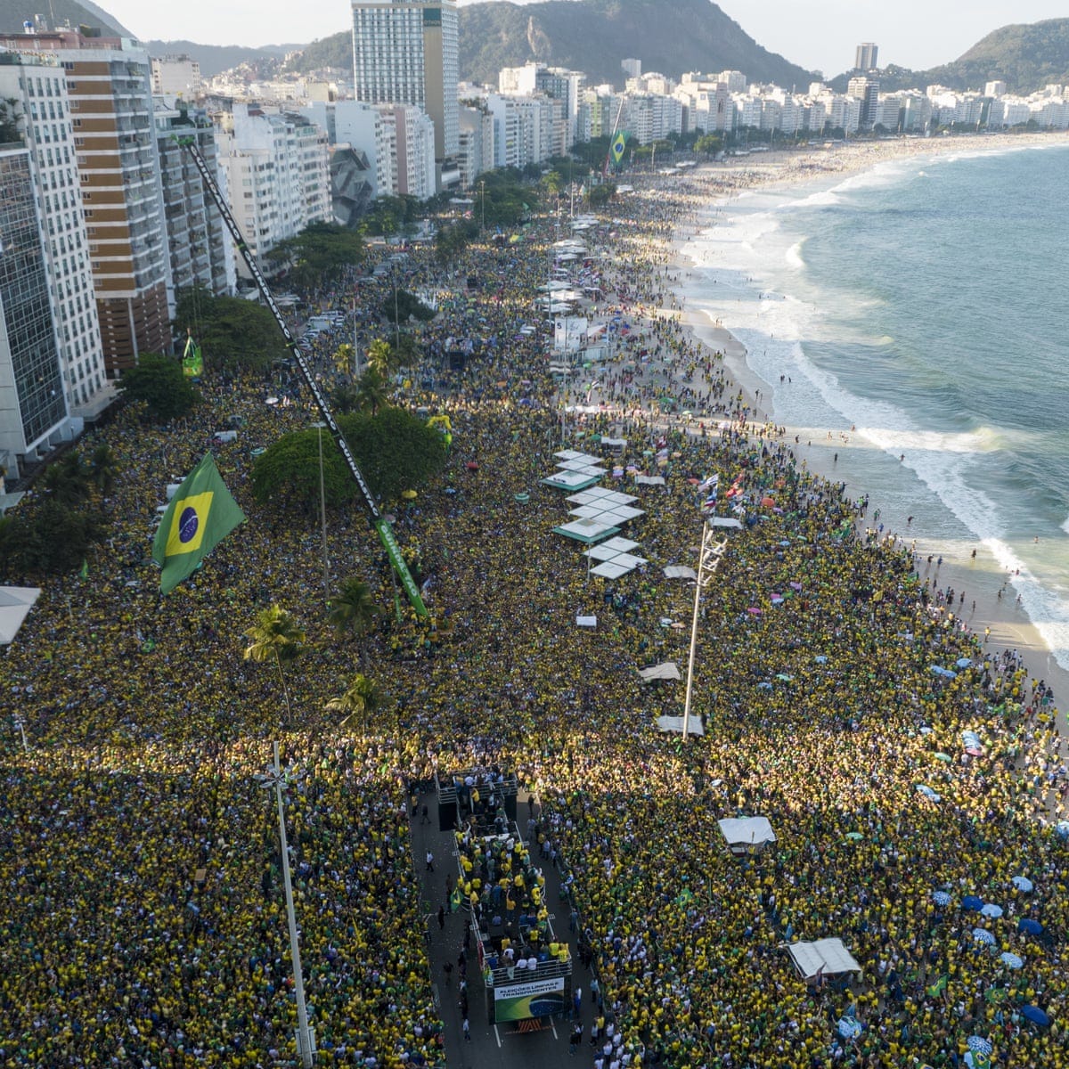 Bolsonaro supporters fill Copacabana beach in yellow-shirted show of force  | Brazil | The Guardian