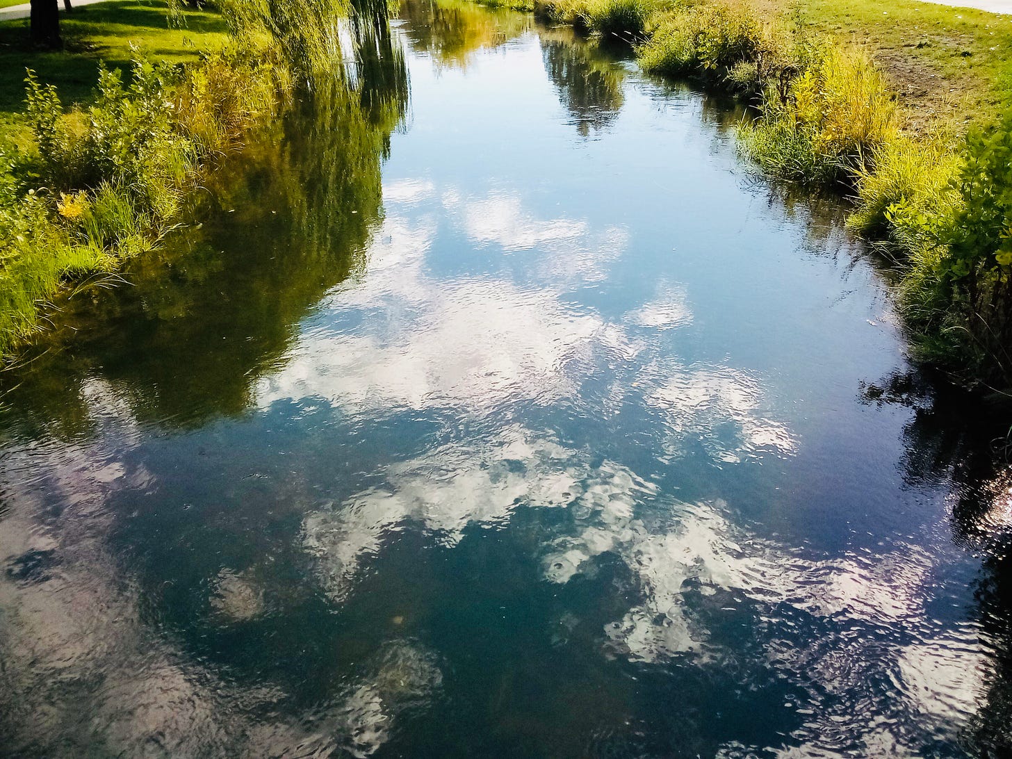Clouds reflected in a stream