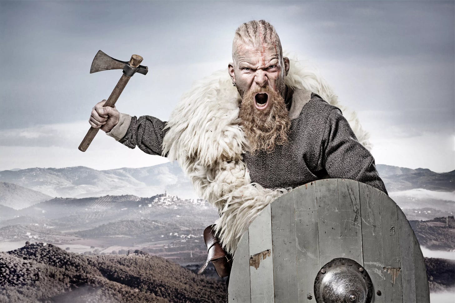 Viking warrior against mountain range